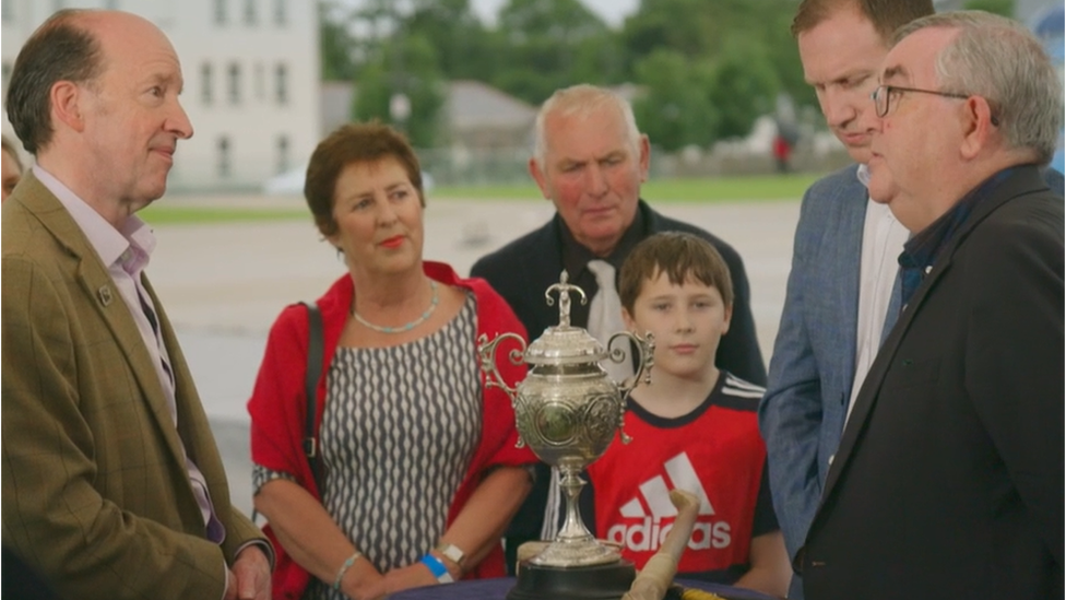 Derry senior hurling championship trophy being appraised by antique expert