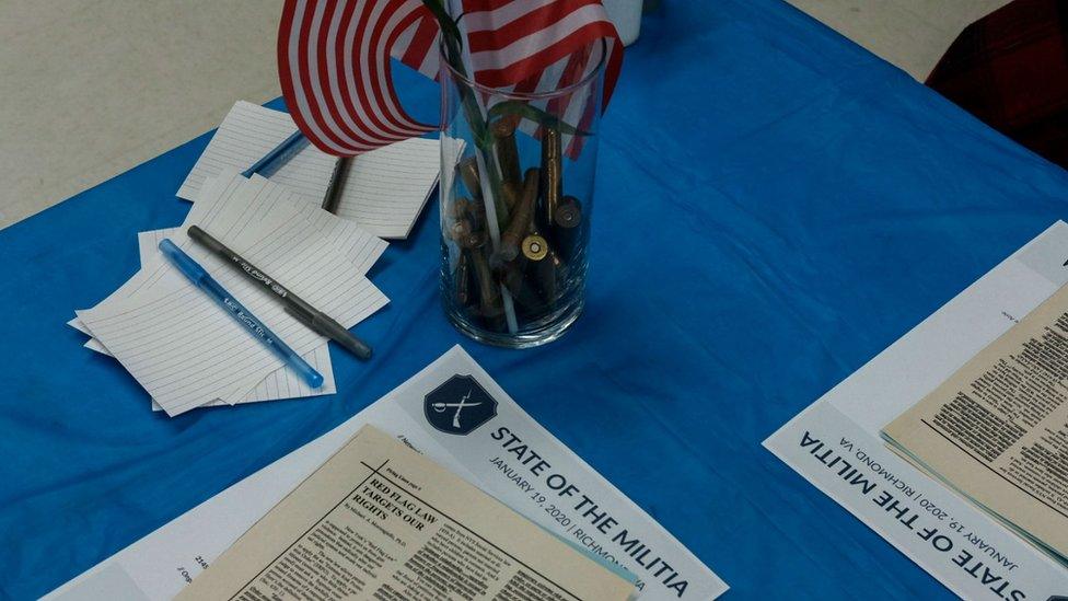 Bullets and pamphlets are pictured at a militia meeting ahead of the Virginia rally