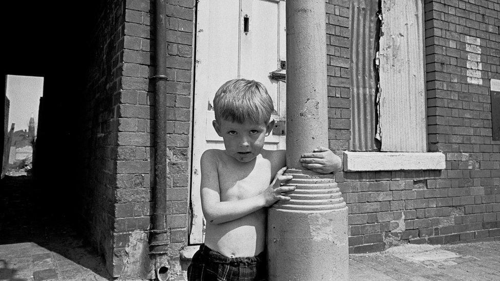 Child living in slum area of Birmingham 1969