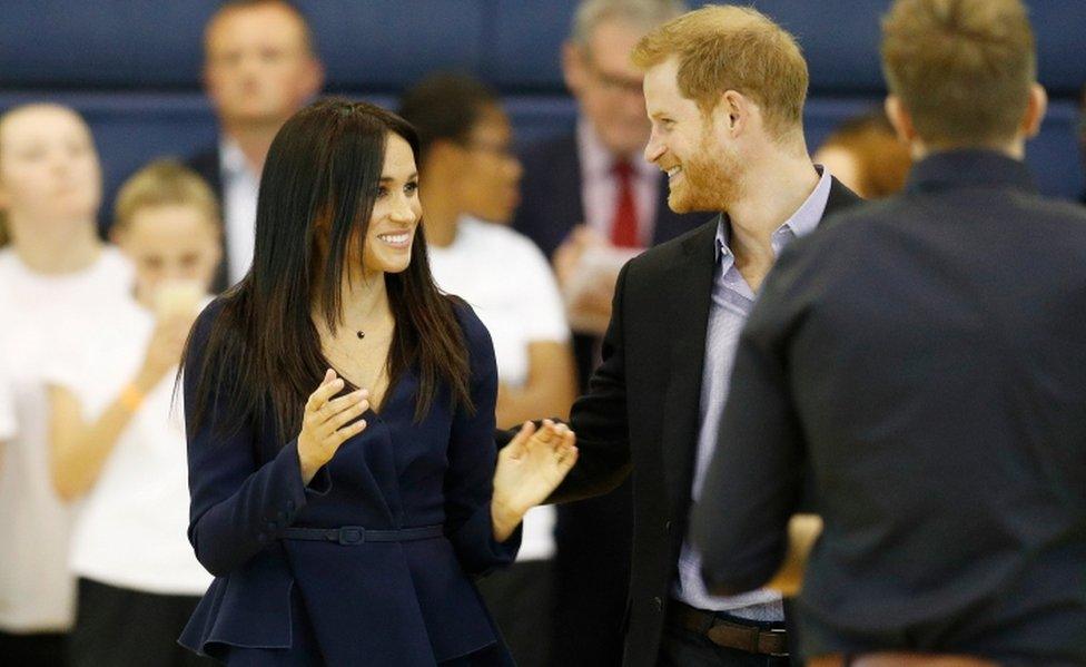 The Duke and Duchess of Sussex smile on the netball court during a masterclass at Loughborough University