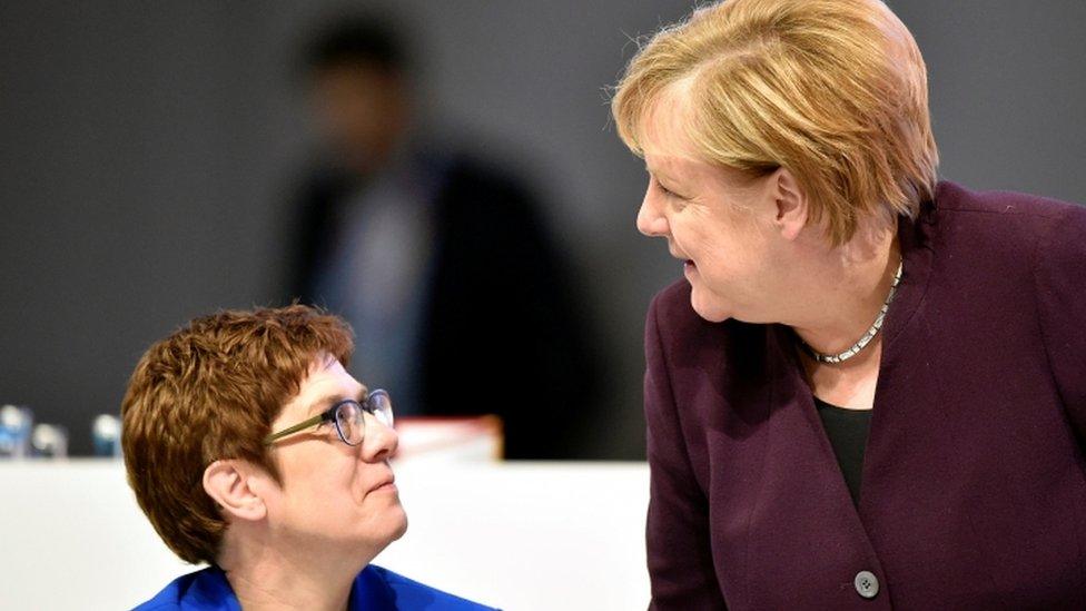 Angela Merkel talks to party chairwoman Annegret Kramp-Karrenbauer during the Christian Democratic Union (CDU) party congress in Leipzig