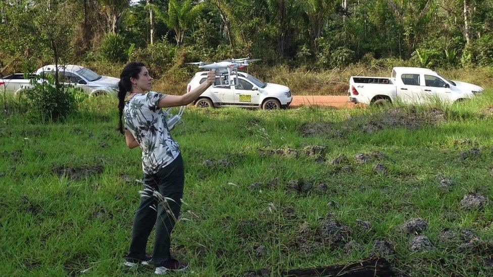 Scientist flying a drone