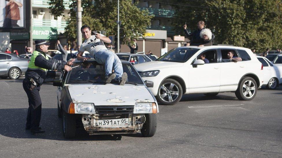 MMA supporters celebrate in the streets of Dagestan