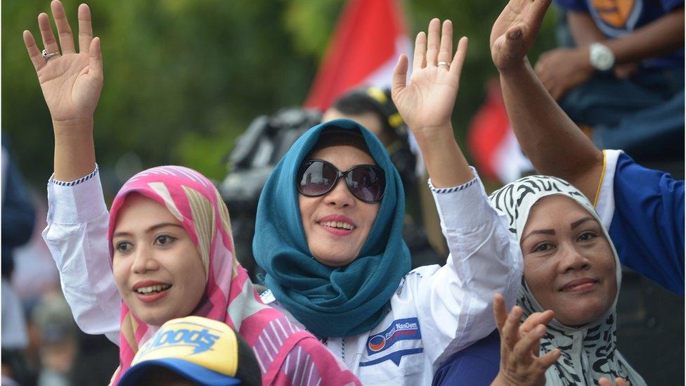 Indonesian people shout slogans as they attend a pro-government rally to call for unity in Jakarta on December 4, 2016