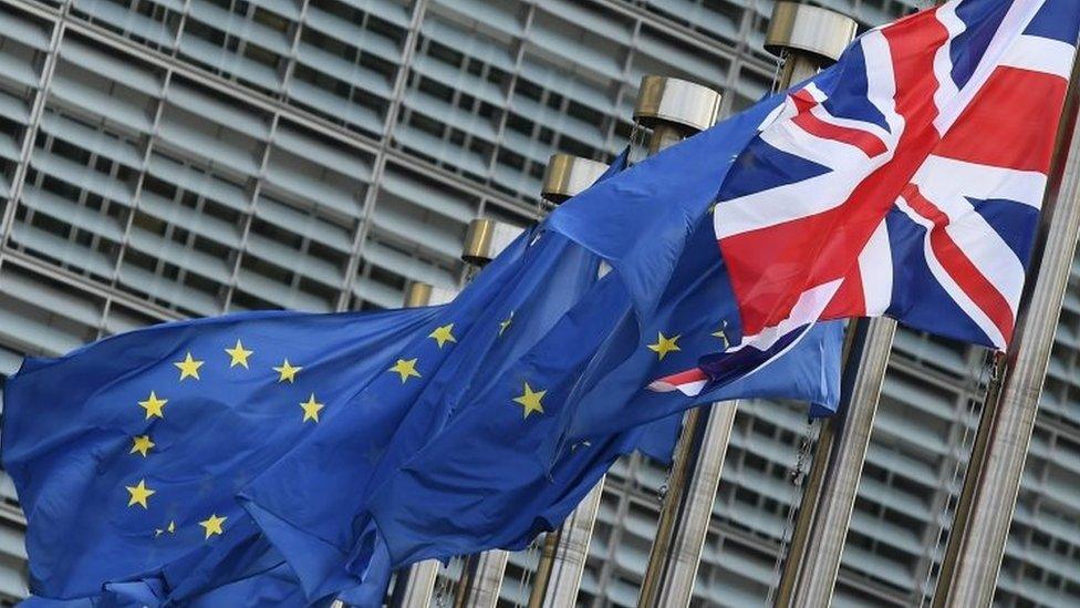 A British flag flies next to EU flags in Brussels. File photo