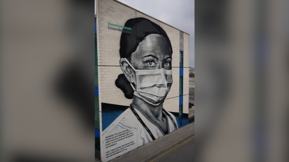 Completed mural of an NHS staff member wearing PPE.