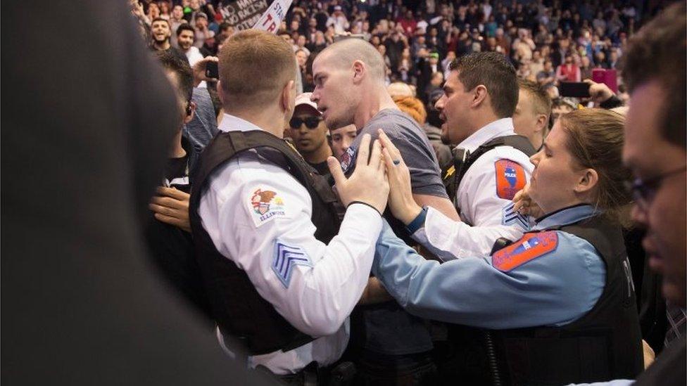 Police break up skirmishes between demonstrators and supporters of Republican presidential candidate Donald Trump