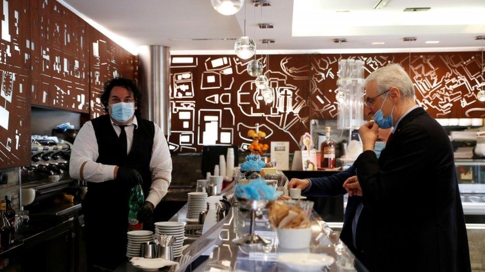 A man at a cafe in Italy