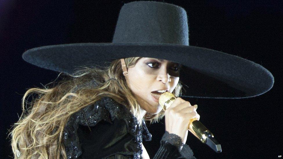 Beyonce wearing a big hat
