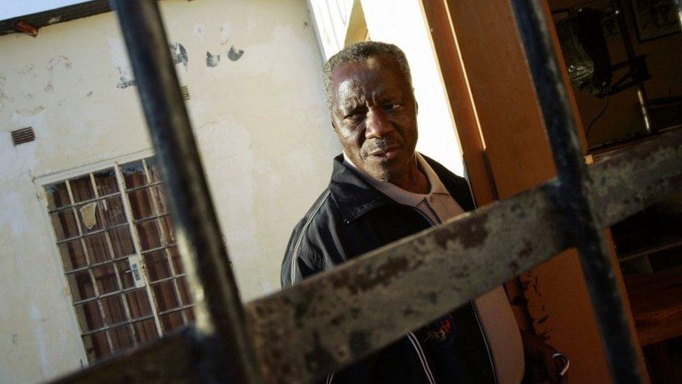 In this file photo taken on June 07, 2006, South African photojournalist Sam Nzima, 71, arrives at his laboratory in the village of Lillydale near the Kruger national park in northeast South Africa.