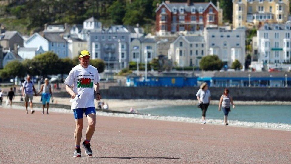 Exercising on the beach at Llandudno