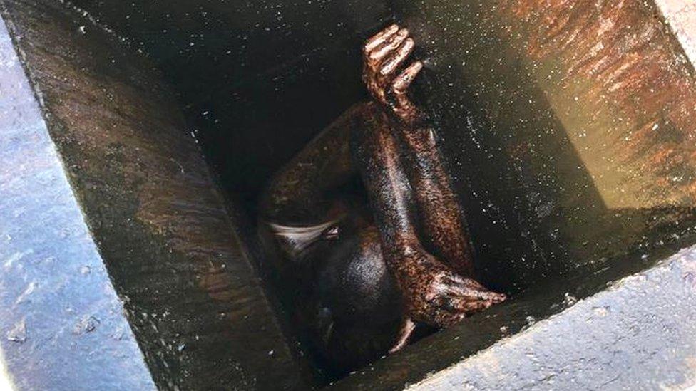 A man is seen trapped in a metal duct at a Chinese restaurant in California