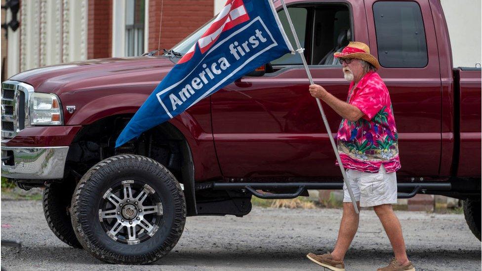 An anti-Biden protestor outside his previous speech in the state earlier this week