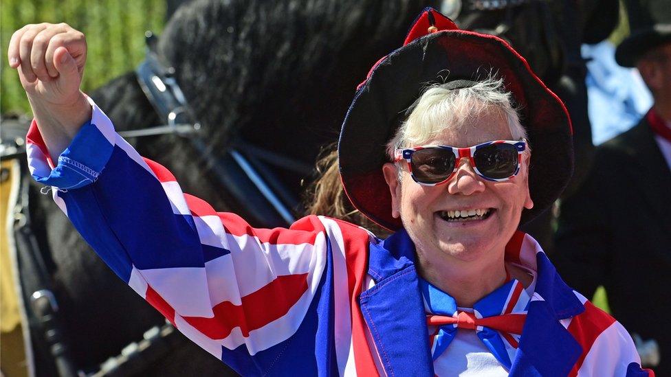 Woman dressed in union jacks on Shankill Road