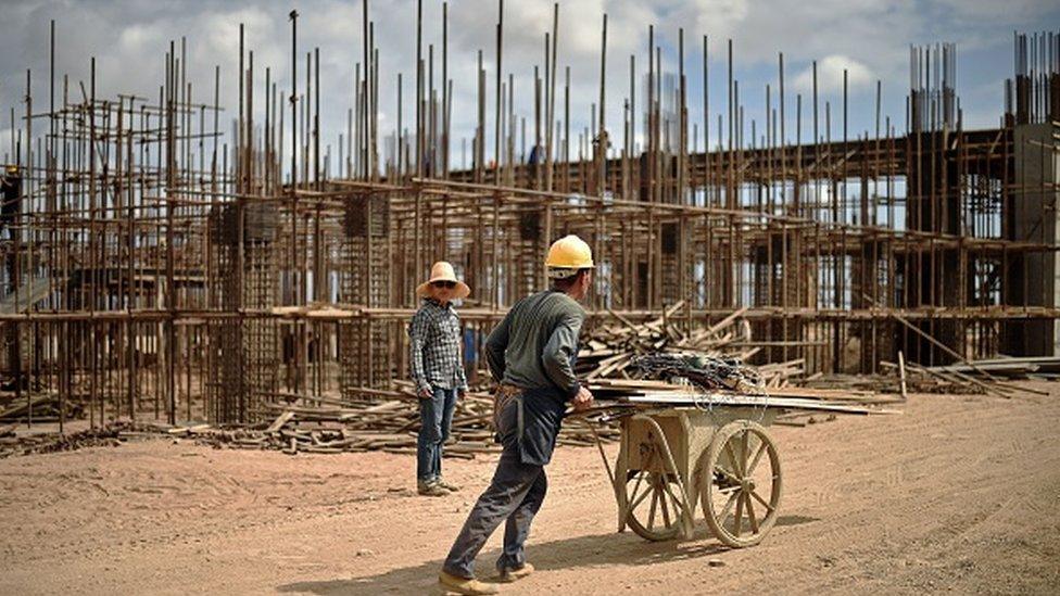 Chinese workers working on railway infrastructure on the new railway tracks linking Djibouti with Addis Ababa