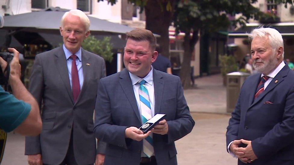 Gary Burgess with award