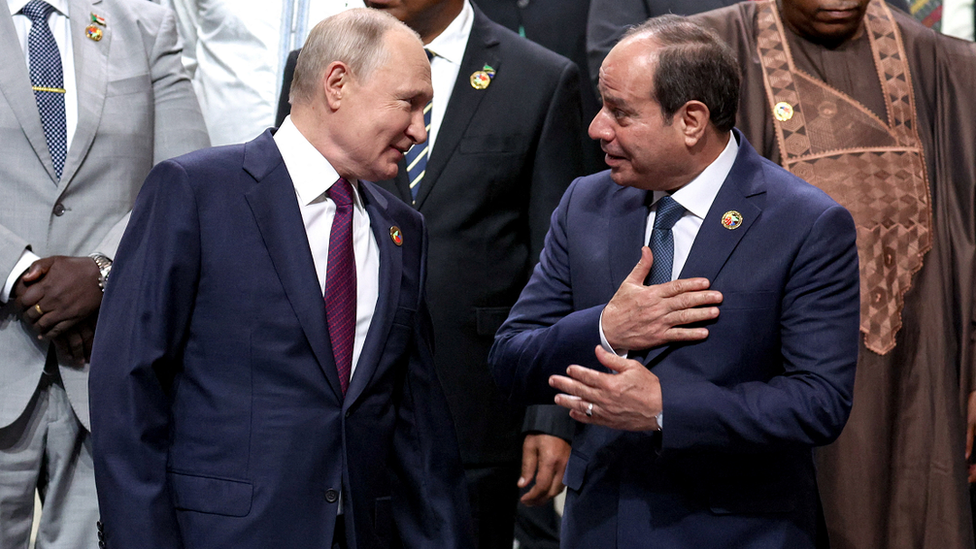 Russian President Vladimir Putin and Egyptian President Abdel Fattah al-Sisi talking as they pose for a photo at the Russia-Africa summit in St Petersburg