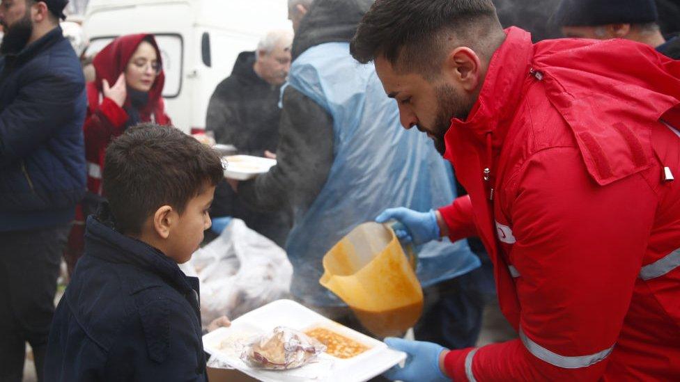 Turkish Red Crescent give out hot meals