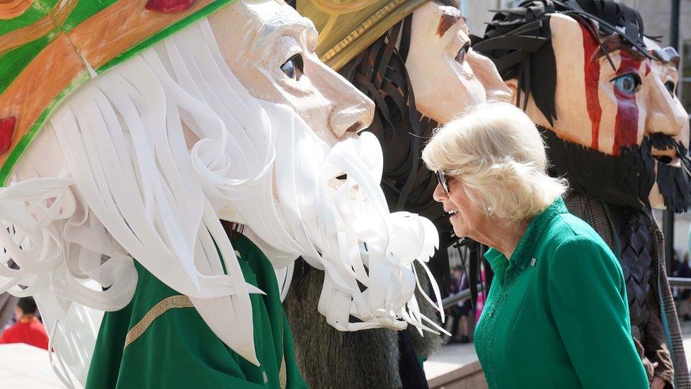 Queen Camilla looking at a large model of St Patrick