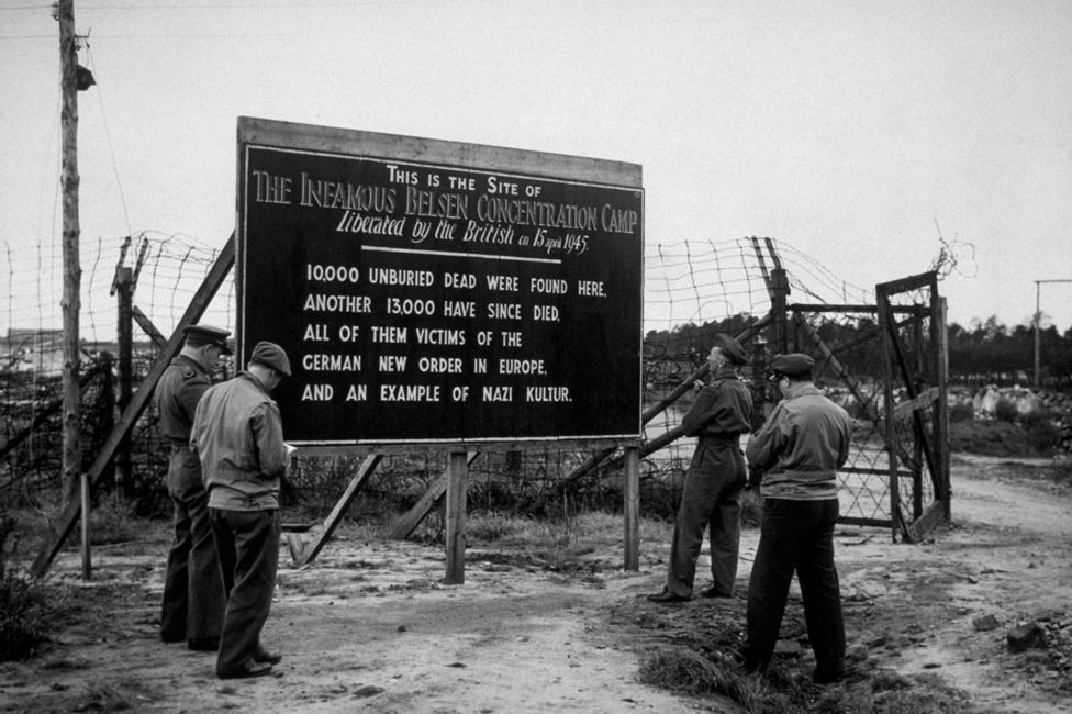 A sign outside Belsen camp after it was liberated and burned: "This is the site of the infamous Belsen concentration camp liberated by the British on 5 April 1945. 10,000 unburied dead were found here, another 13,000 have since died. All of them victims of the German New Order in Europe."