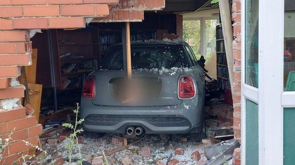 Car embedded in Sandiacre library