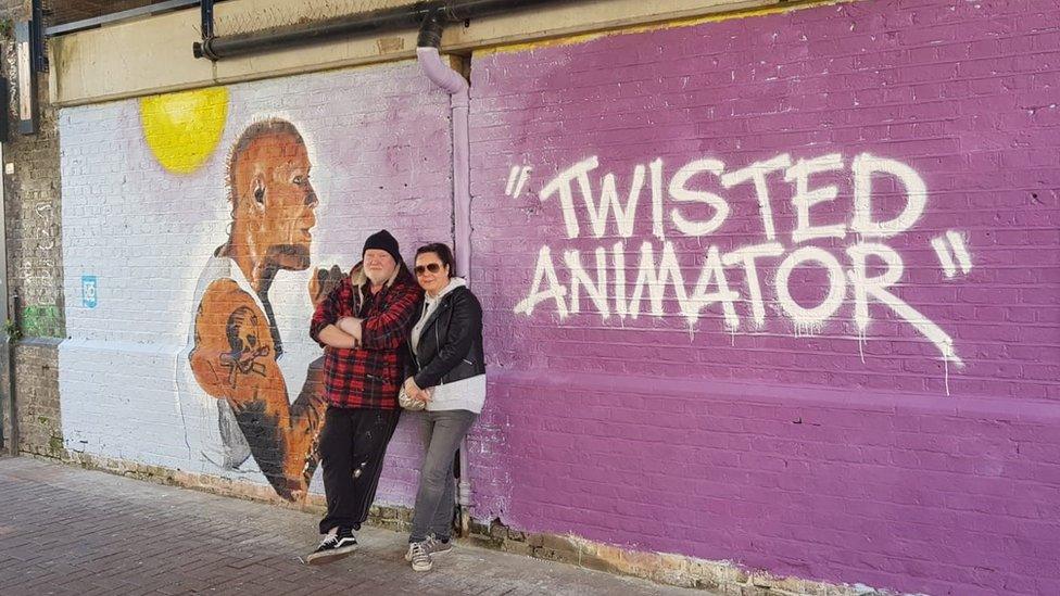 John Bulley and Alison Dewey with the mural