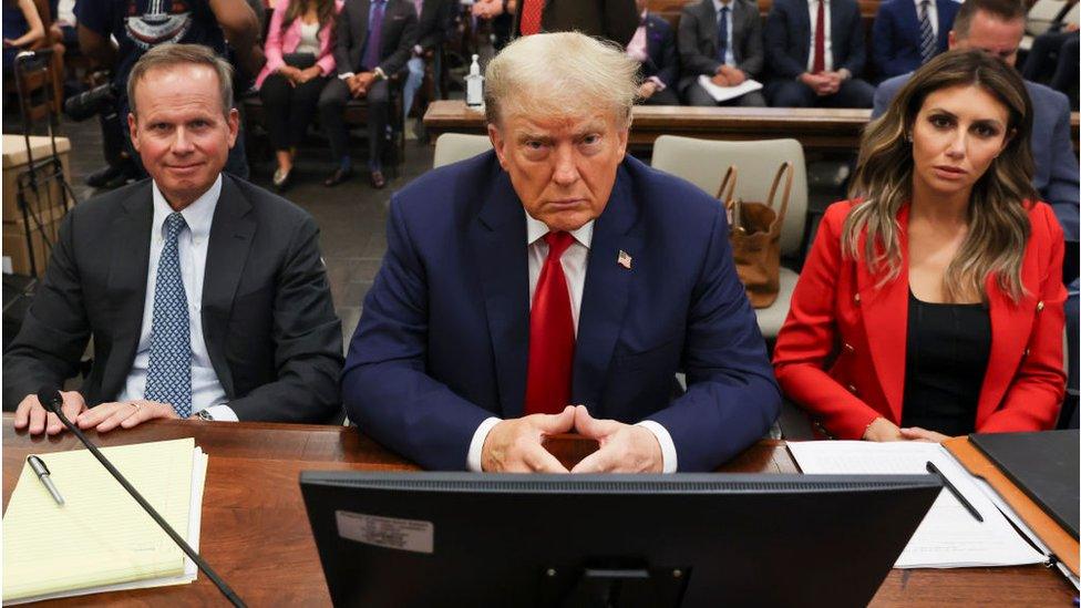 Trump flanked by lawyers at his civil trial in New York