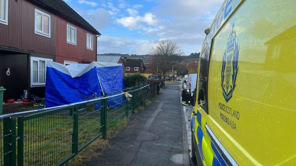 Police van at house