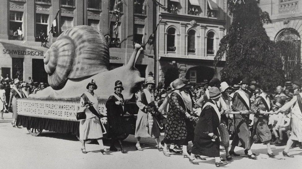 Women demonstrate in the 1920s at the slow pace with which Switzerland is tackling equal rights at work