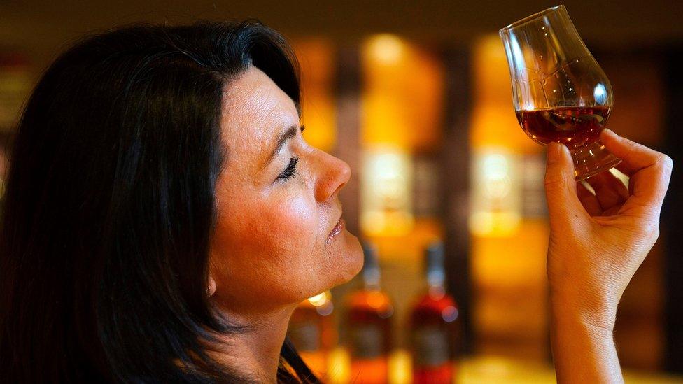 Visitor centre manager, Wendy Dunlop sampling whisky at the Auchentoshan Distillery