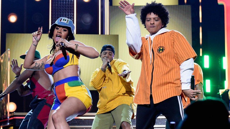 Cardi B and Bruno Mars on stage at the Grammy Awards