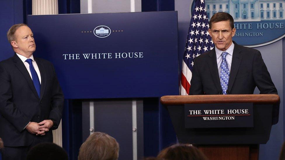 01: White House Press Secretary Sean Spicer (L) yields the briefing room podium to National Security Adviser Michael Flynn February 1, 2017 in Washington, DC