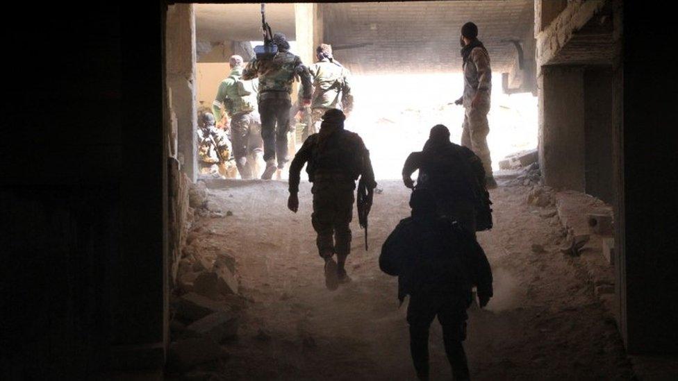 Rebel fighters from the Jaish al-Fatah (or Army of Conquest) brigades gather in position at an entrance to Aleppo, in the south-western frontline during a rebel offensive to break a three-month siege of the opposition-held east of Syria's second city (03 November 2016)