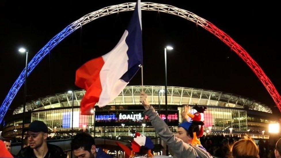 Wembley Stadium lit up in French colours