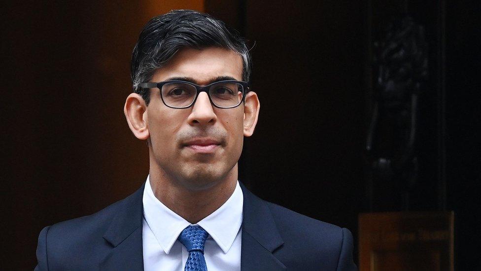 British Prime Minister Rishi Sunak walking out the door of 10 Downing Street