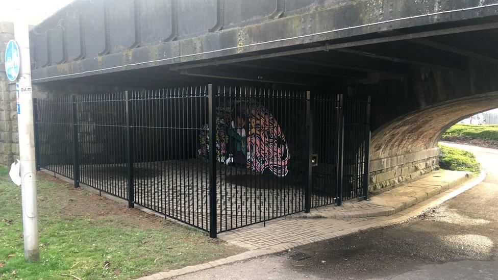 Fencing underneath a railway bridge in Cardiff