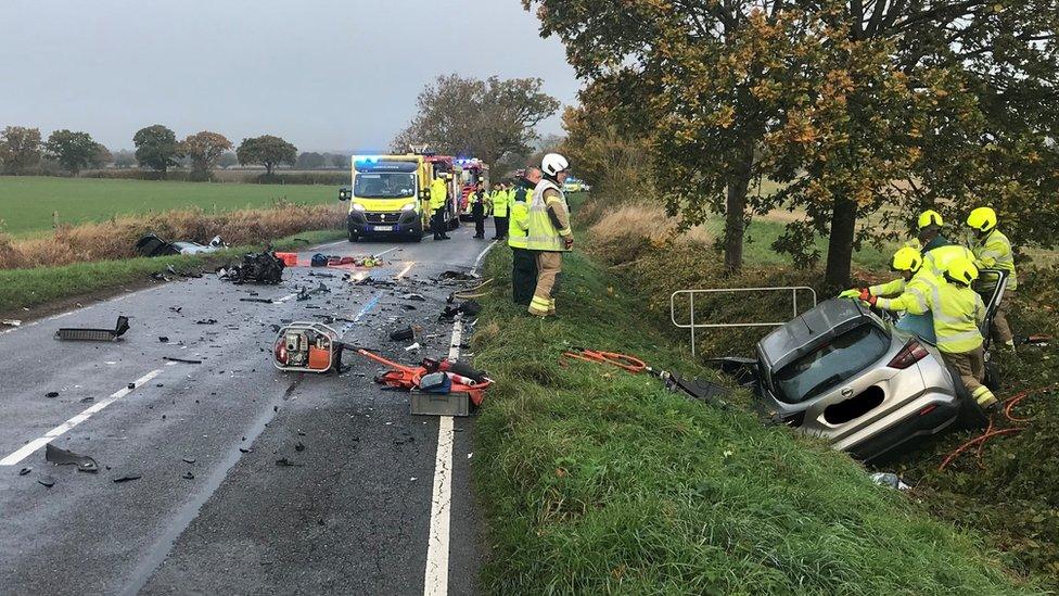 Firefighters at the scene of a crash