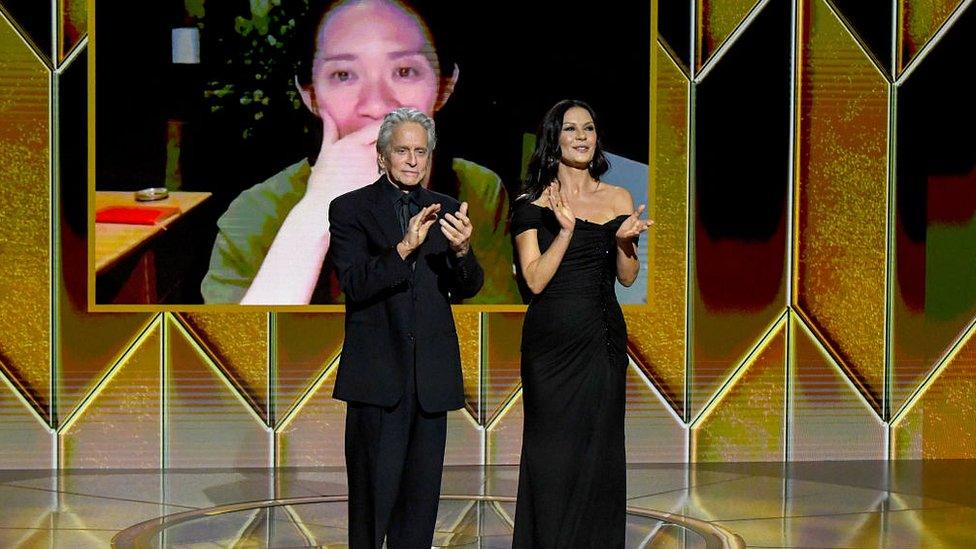 Michael Douglas and Catherine Zeta-Jones present the award for Best Picture Drama to Chloé Zhao