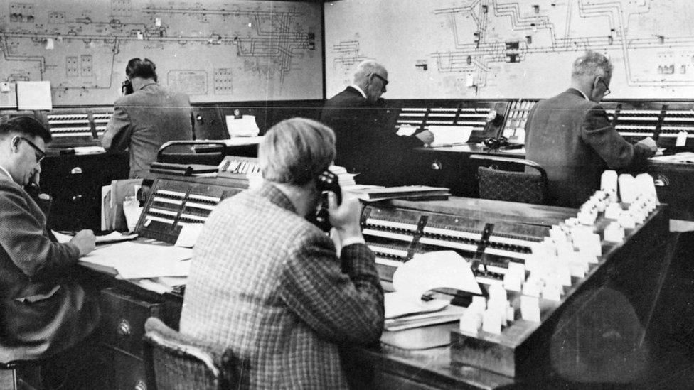 Workers in control room