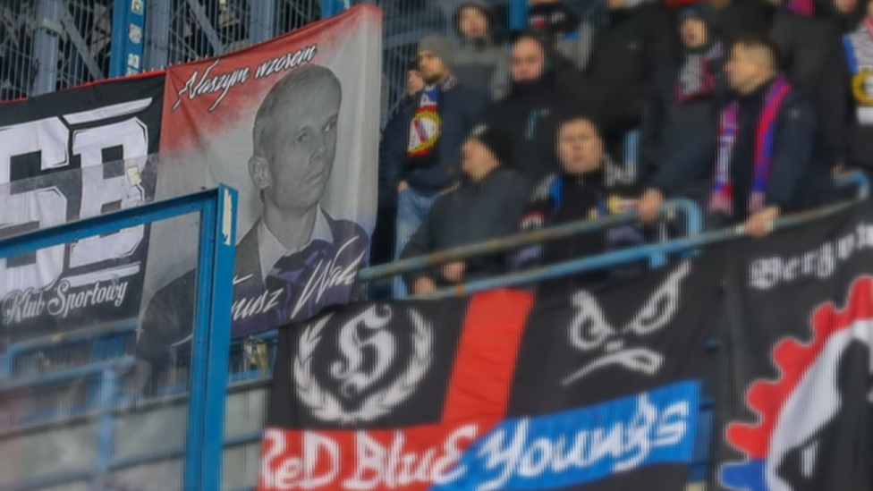 Fans displaying Walus banner