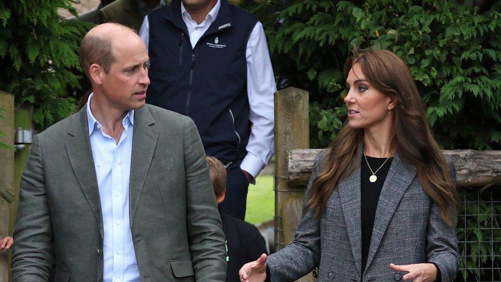 The Prince and Princess of Wales speaking while standing next to each other