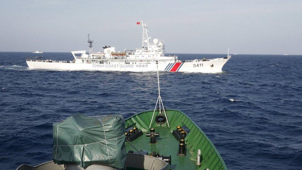 A Chinese Coast Guard ship (top) is seen near a Vietnam Marine Guard ship in the South China Sea, about 210 km (130 miles) off shore of Vietnam, in this 14 May 2014 file photo