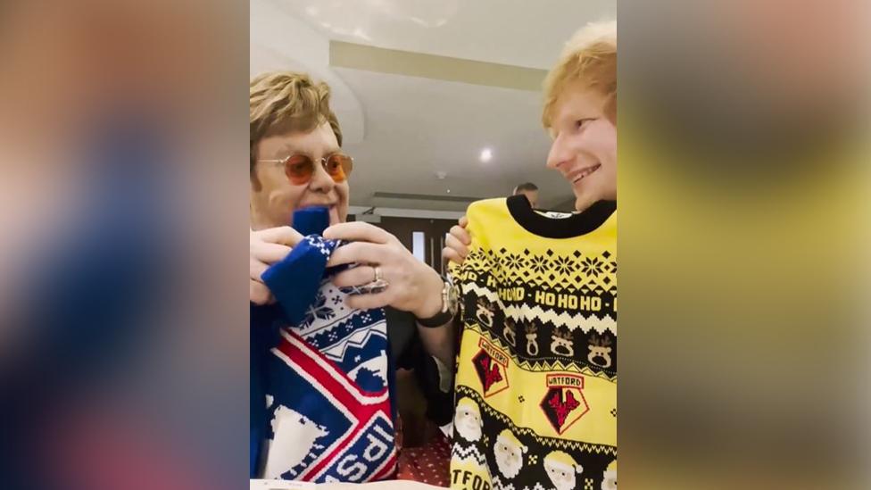 Elton John and Ed Sheeran with Ipswich Town and Watford Christmas jumpers