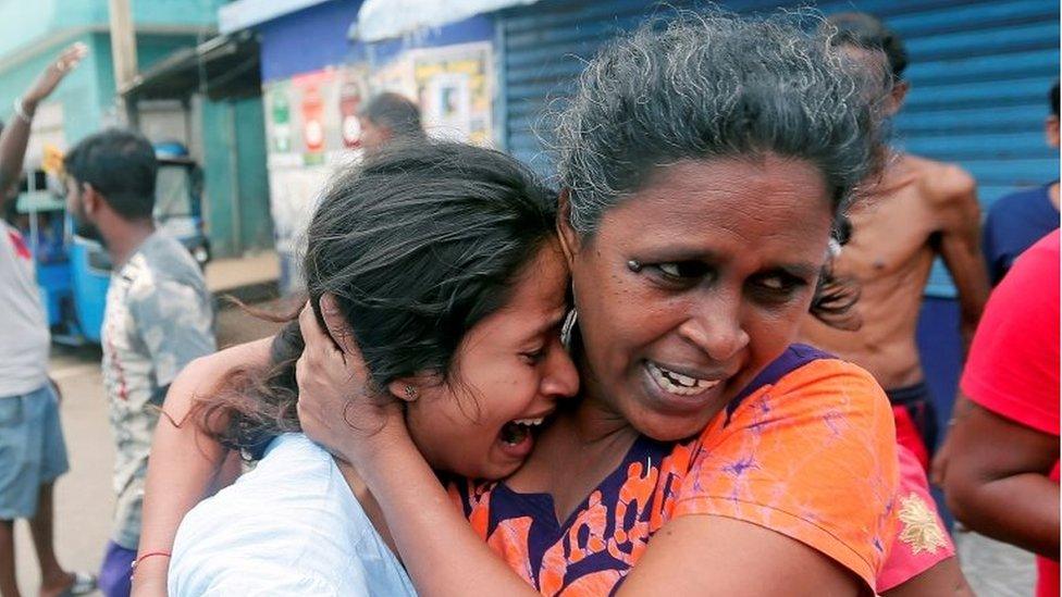 People who live near the church that was attacked yesterday, leave their houses as the military try to defuse a suspected van before it exploded in Colombo, Sri Lanka April 22, 2019.