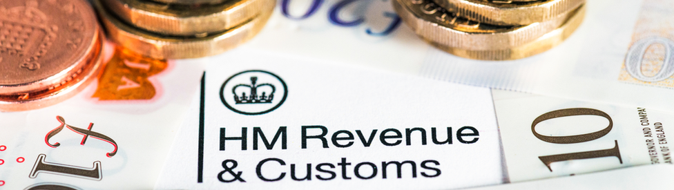 Money and a document with the HMRC logo