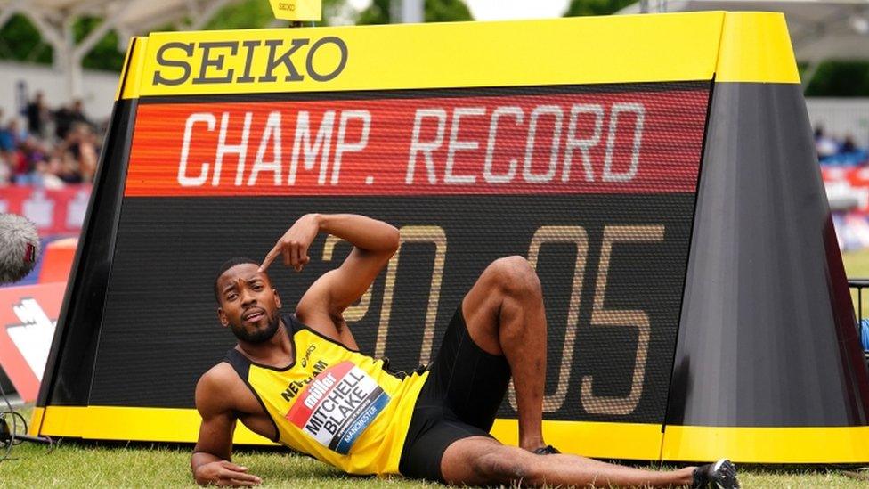 Nethaneel Mitchell-Blake poses with the timing board