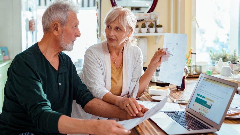 Elderly couple reviewing finances