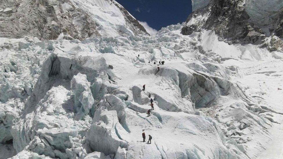 Aerial picture showing climbers crossing the Khumbu icefall of Mount Everest, as seen from the Everest Base Camp