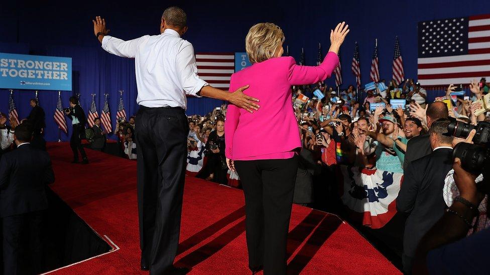 Democratic presidential candidate former Secretary of State Hillary Clinton (R) and U.S. president Barack Obama greet supporters during a campaign rally on July 5, 2016 in Charlotte, North Carolina