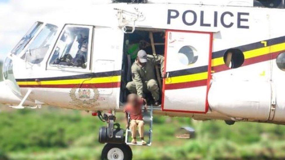 Boy is rescued from flood waters